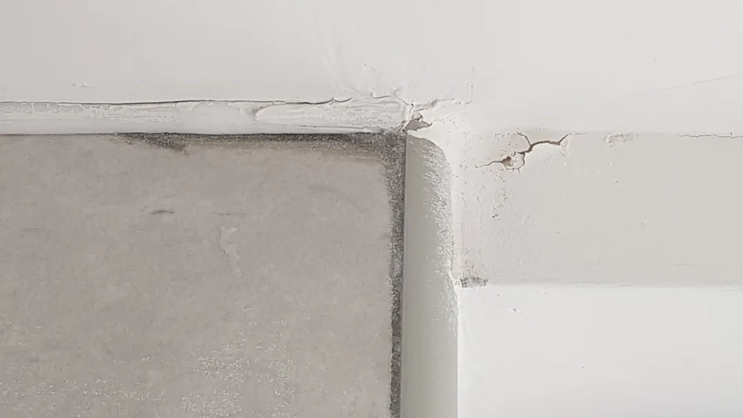 Botched caulk application and paint cracks