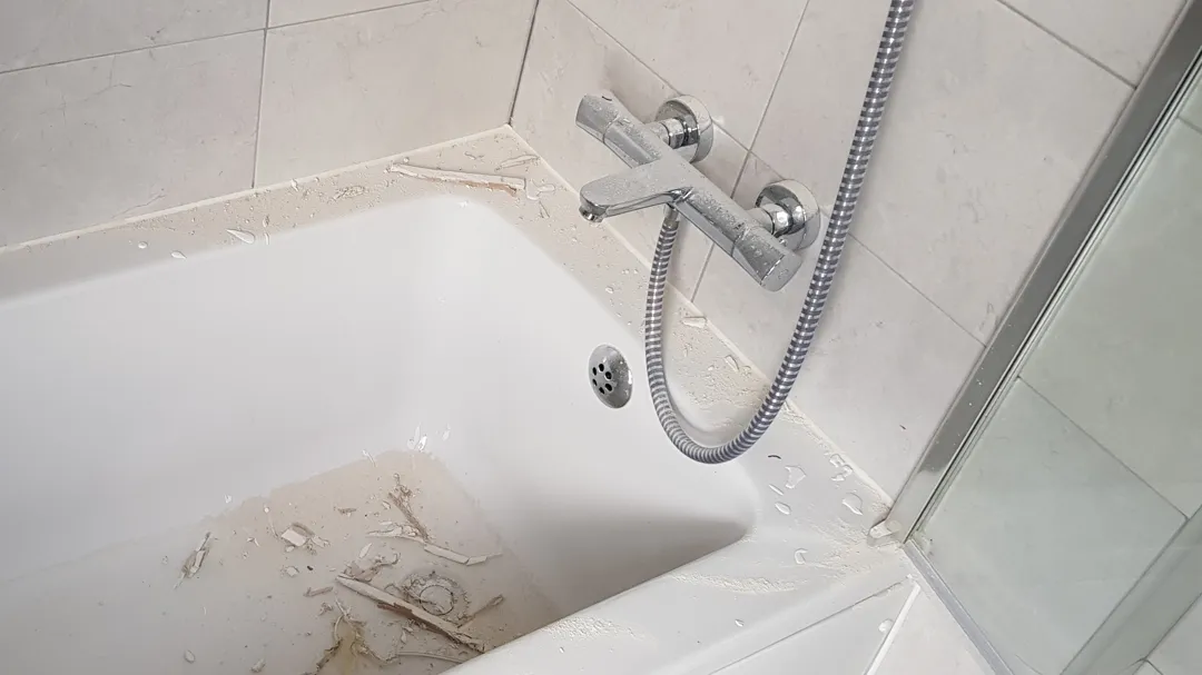 Mess in the bathtub while fixing the bathroom hole